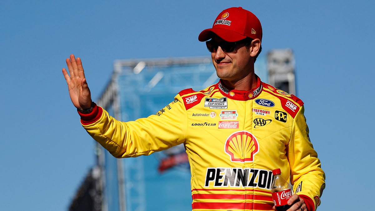 Joey Logano waves