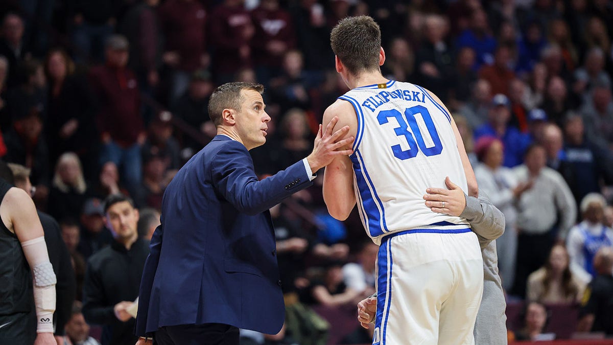 Duke head coach Jon Scheyer and center Kyle Filipowski