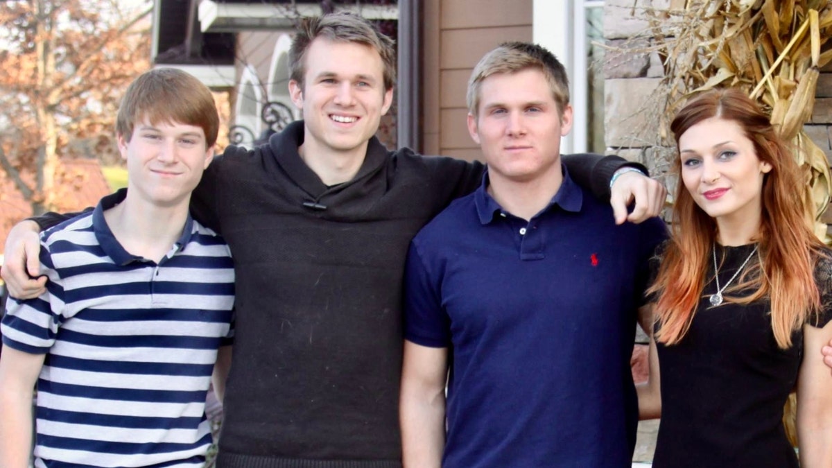 Megan Drumhiller poses with her brothers for a photo