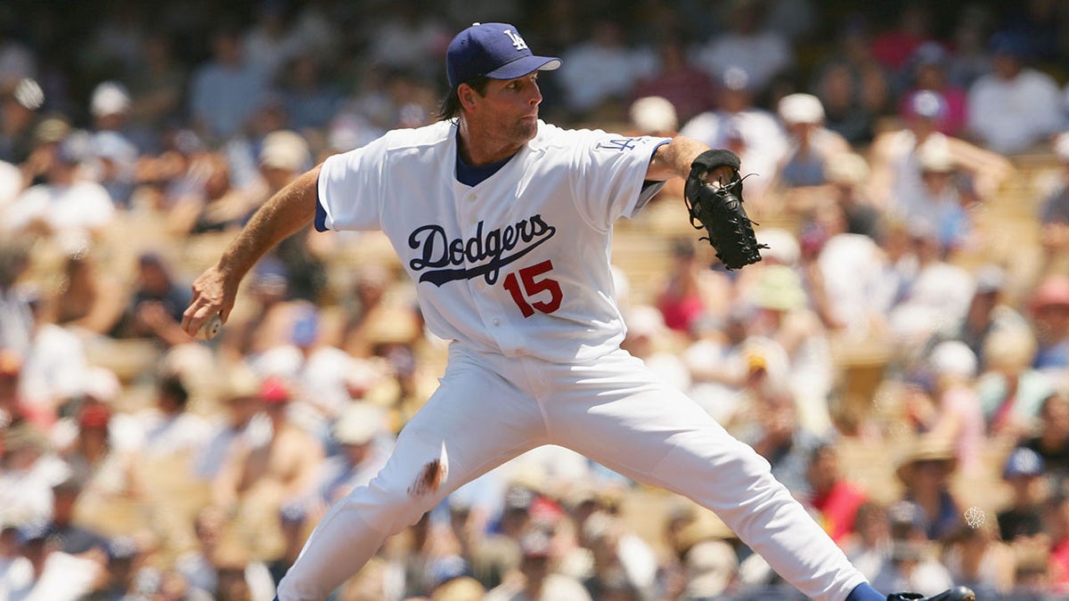 Scott Erickson pitches during a game