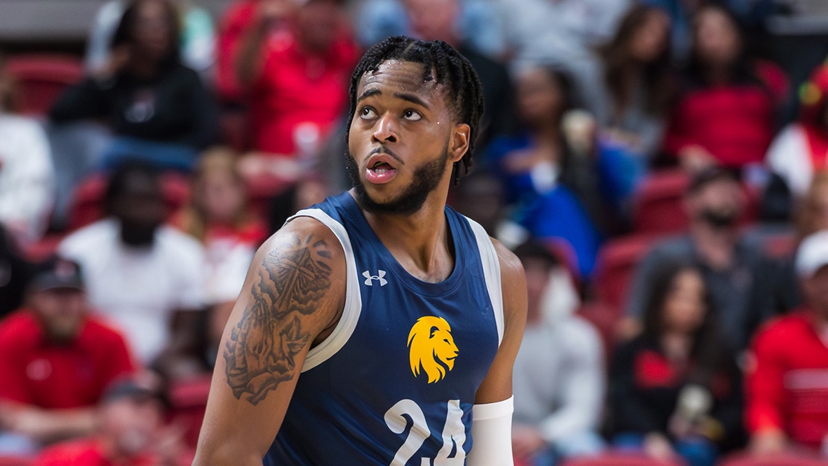 Jerome Brewer Jr. looks up on court