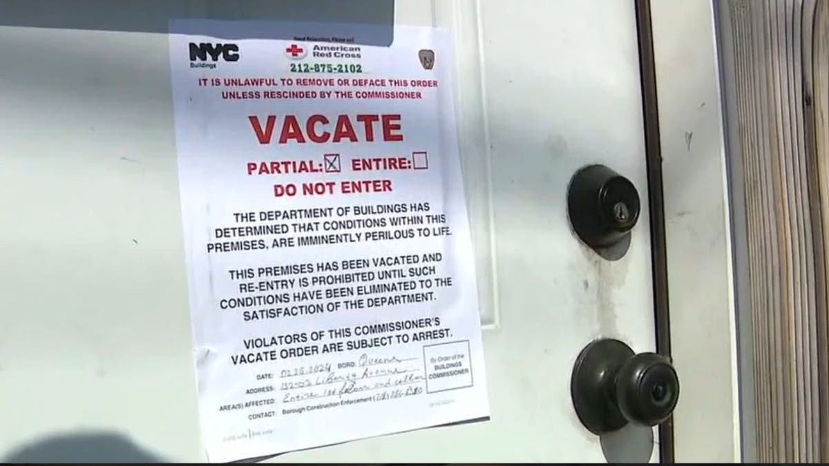 A vacate order pinned to the door of the store