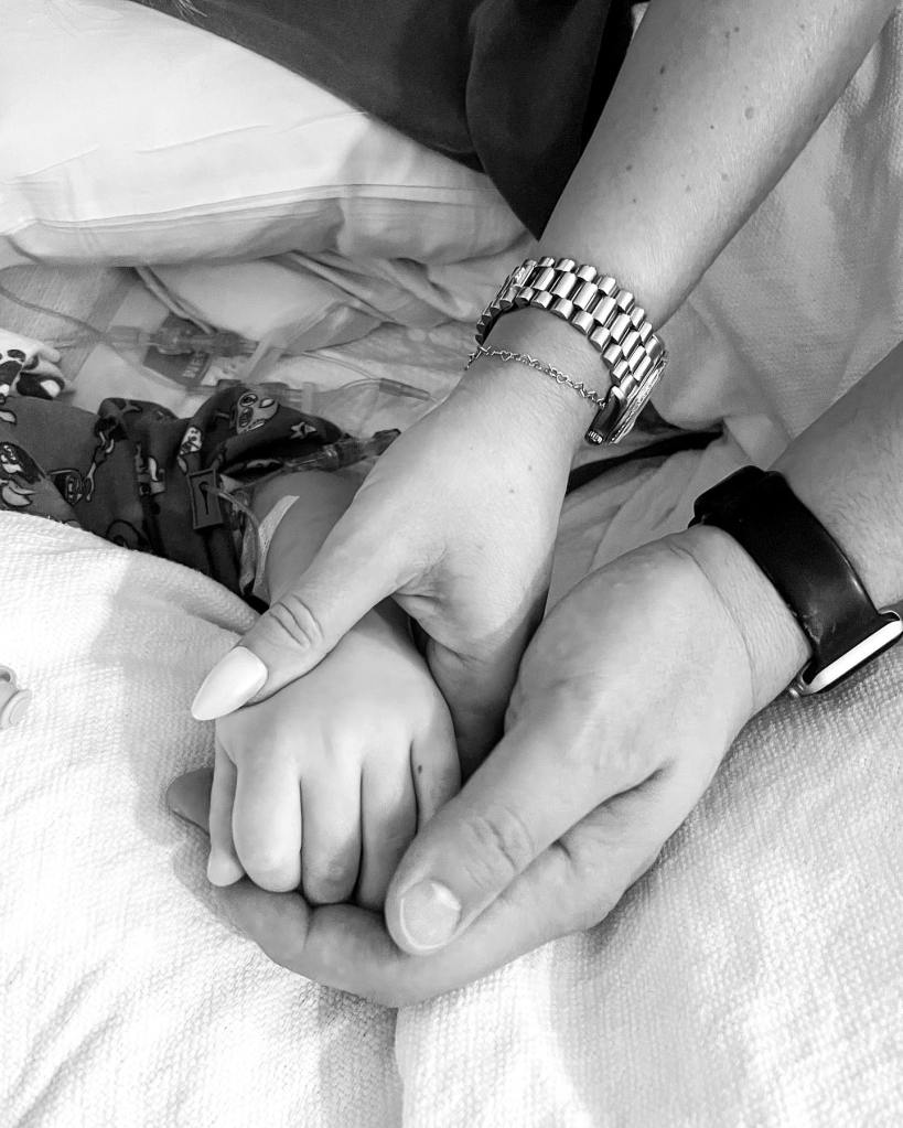 young boy's hand in hospital