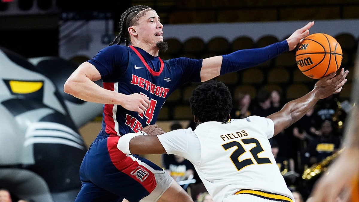 Detroit Mercy Titans guard Jayden Stone attempts a pass