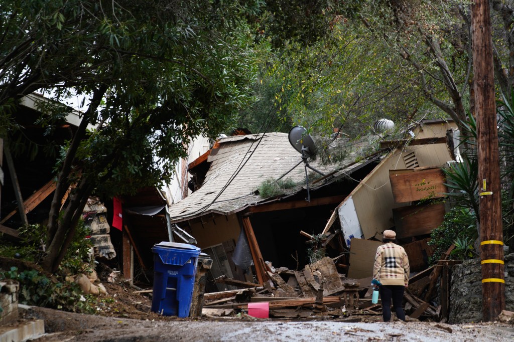A damaged house after heavy rains and mud flows caused it to slide down from the hill in Beverly Glen section of Los Angeles.