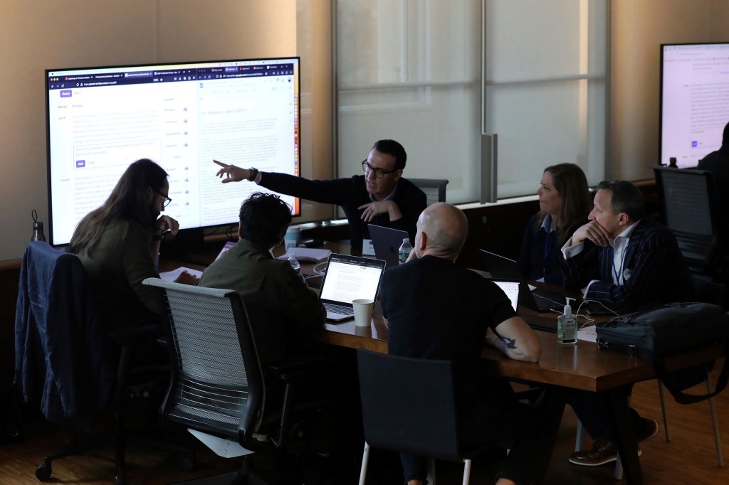 This photo provided by Lauren Feeney shows a group of election officials and AI experts from civil society, academia, industry and journalism testing how different AI models respond to queries voters might ask about elections