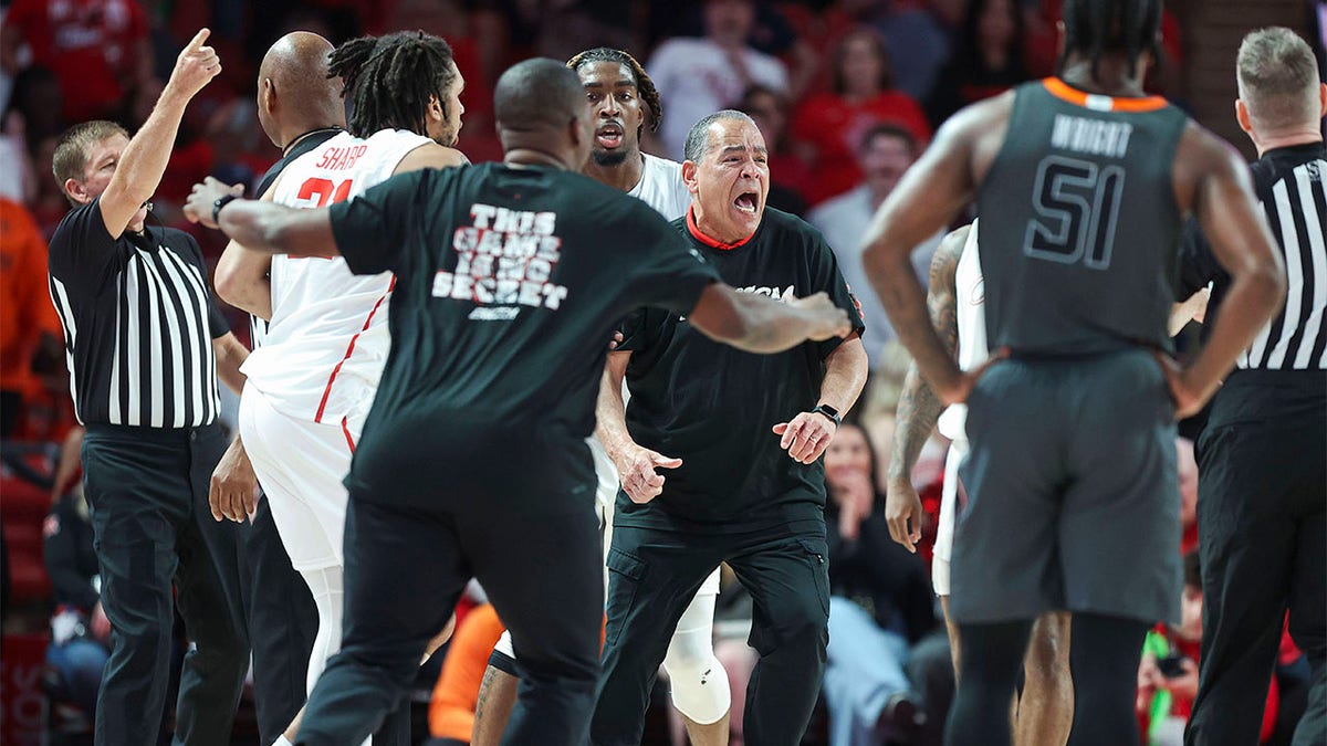 Kelvin Sampson runs onto the court