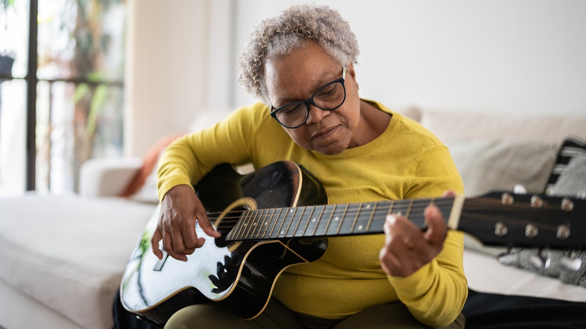 Woman playing guitar