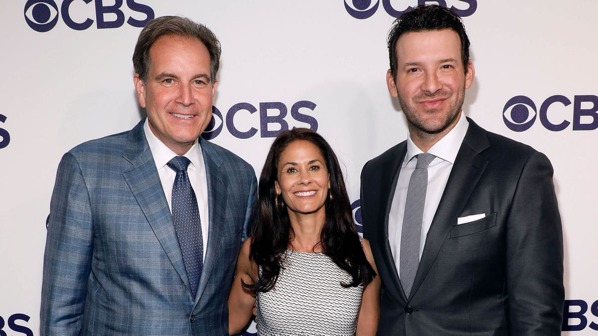 Jim Nantz, Tracy Wolfson and Tony Romo pose