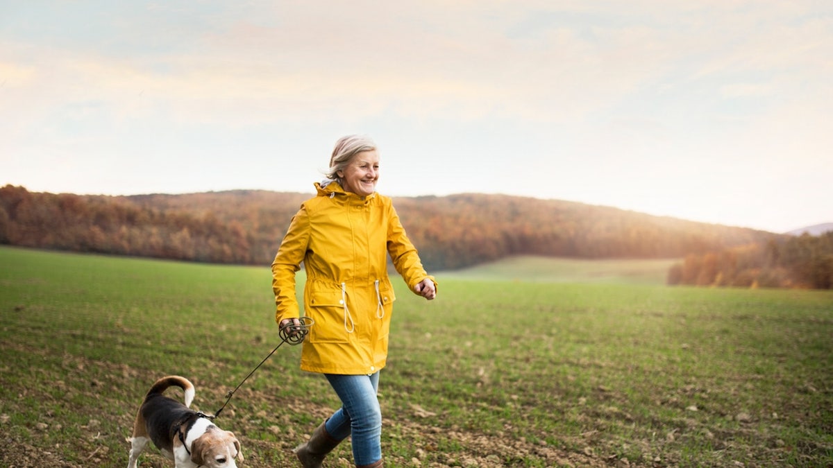 Woman walking dog