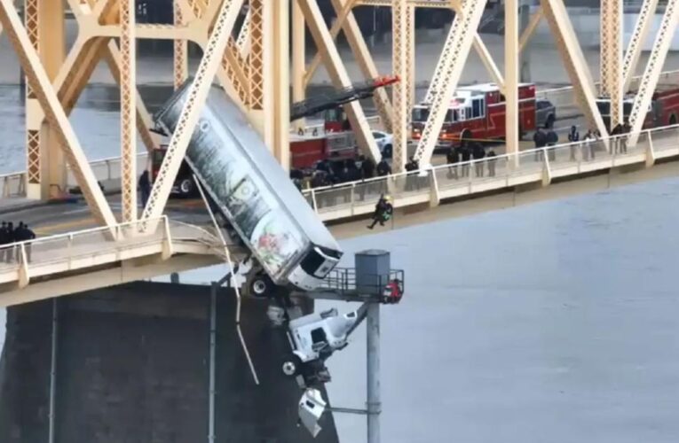 Driver pulled from truck dangling from Louisville bridge over Ohio River