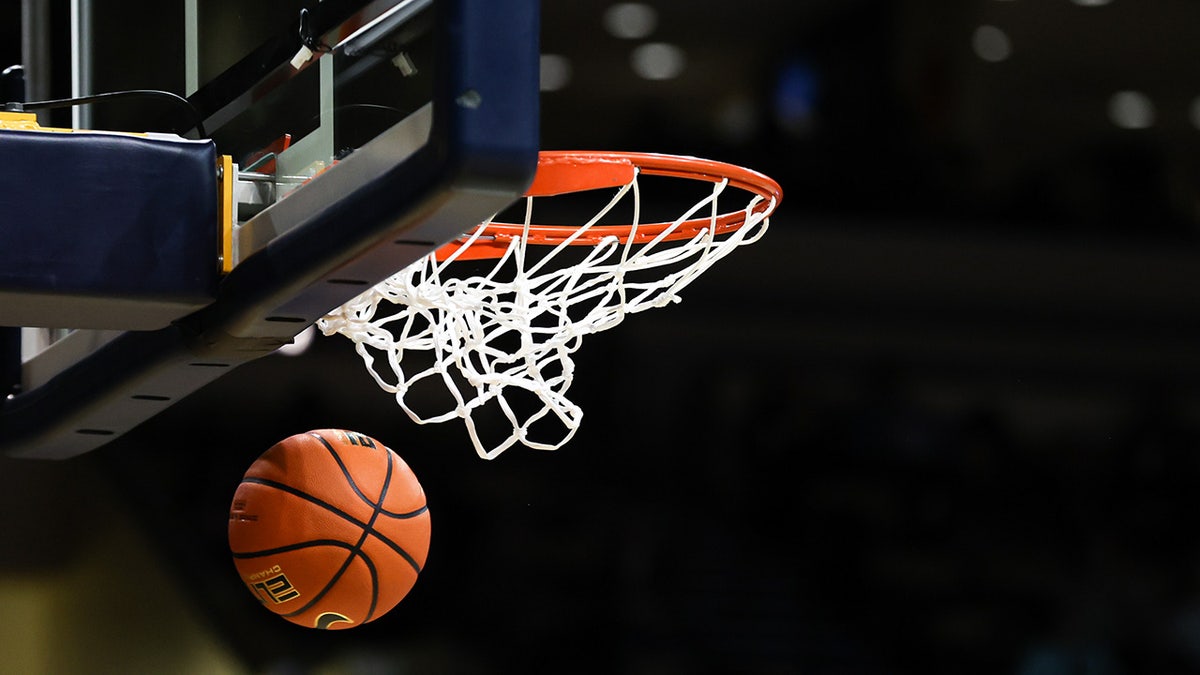 Basketball going through the hoop