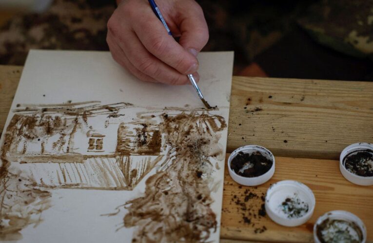 Ukrainian artist-turned-soldier uses mud and ash from the front lines to paint nature, war