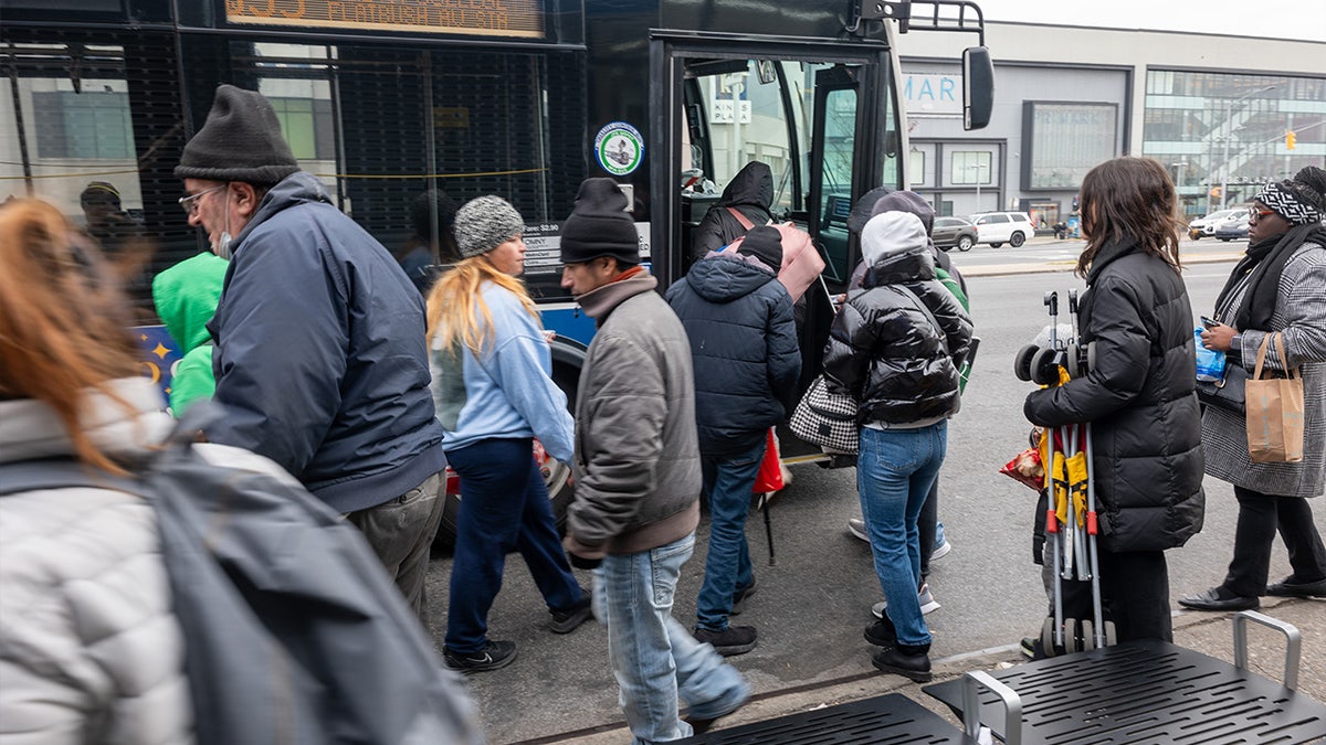 Migrants at bus stop in New York City