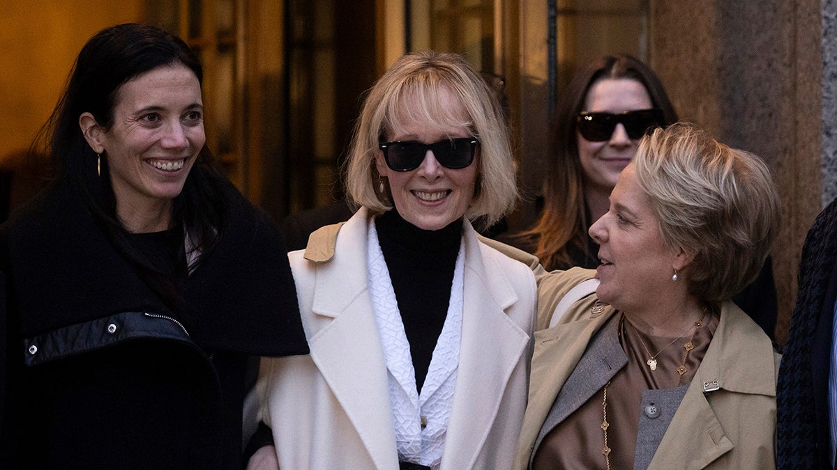 E. Jean Carroll smiles outside courthouse