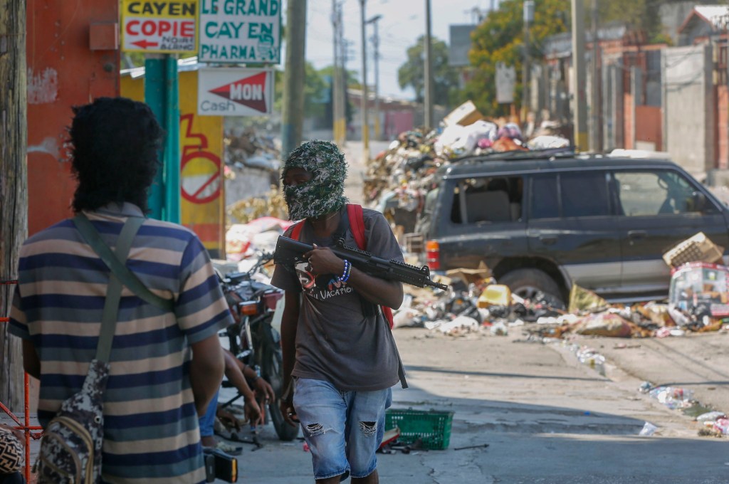 The Prime Minister has been unable to enter Haiti because the violence closed its main international airports. 