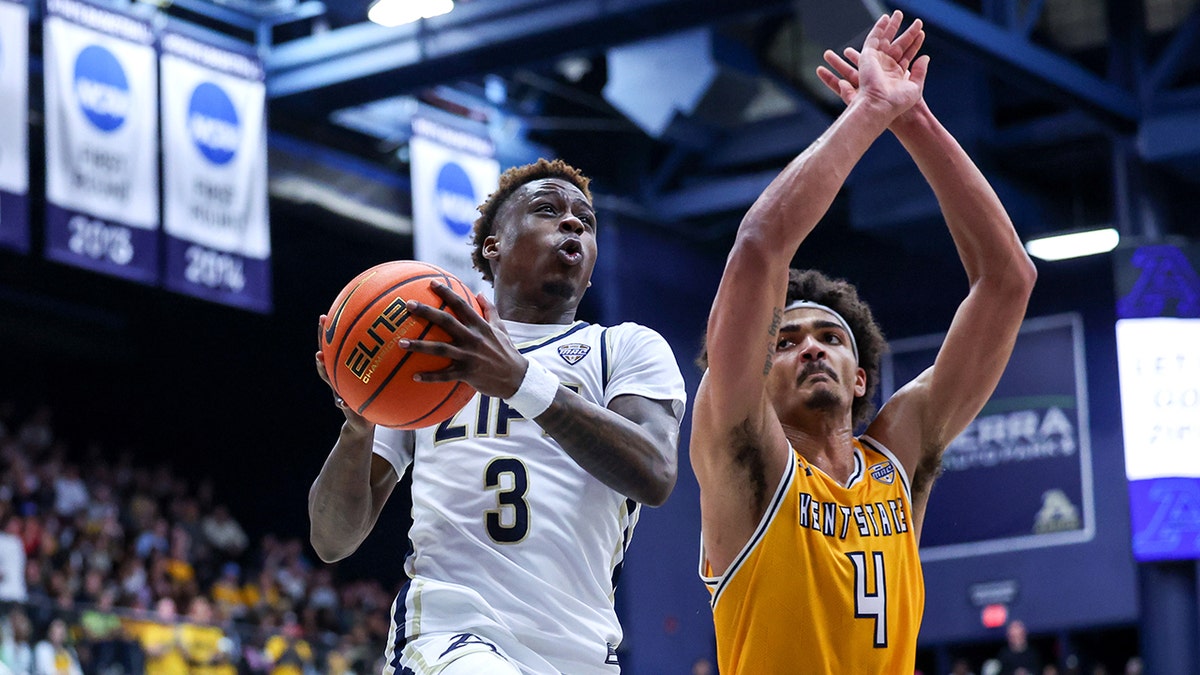 Zips guard Kaleb Thornton drives