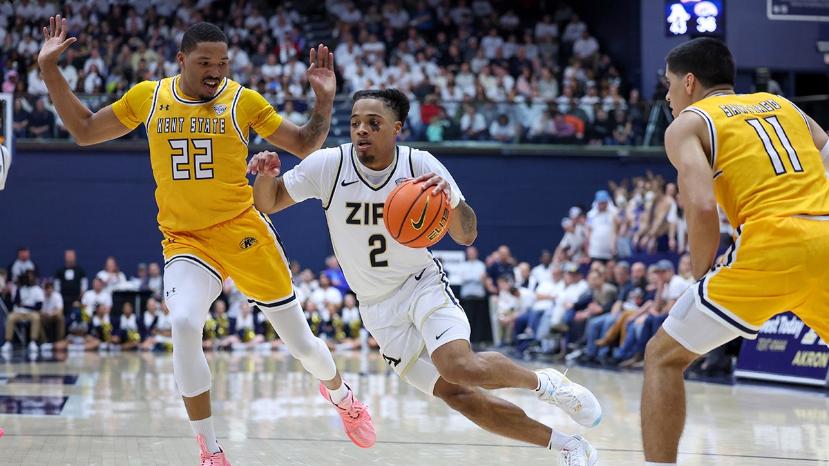 Akron Zips guard Greg Tribble drives