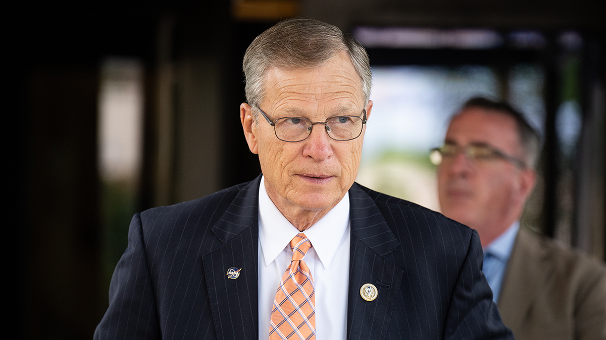 Brian Babin, Texas Republican, in blue coat, orange and gray tie