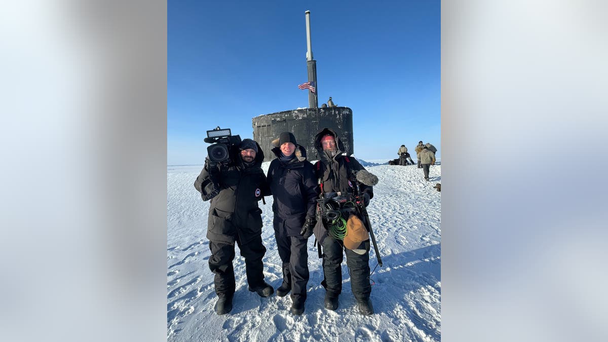 Camera crew outside submarine