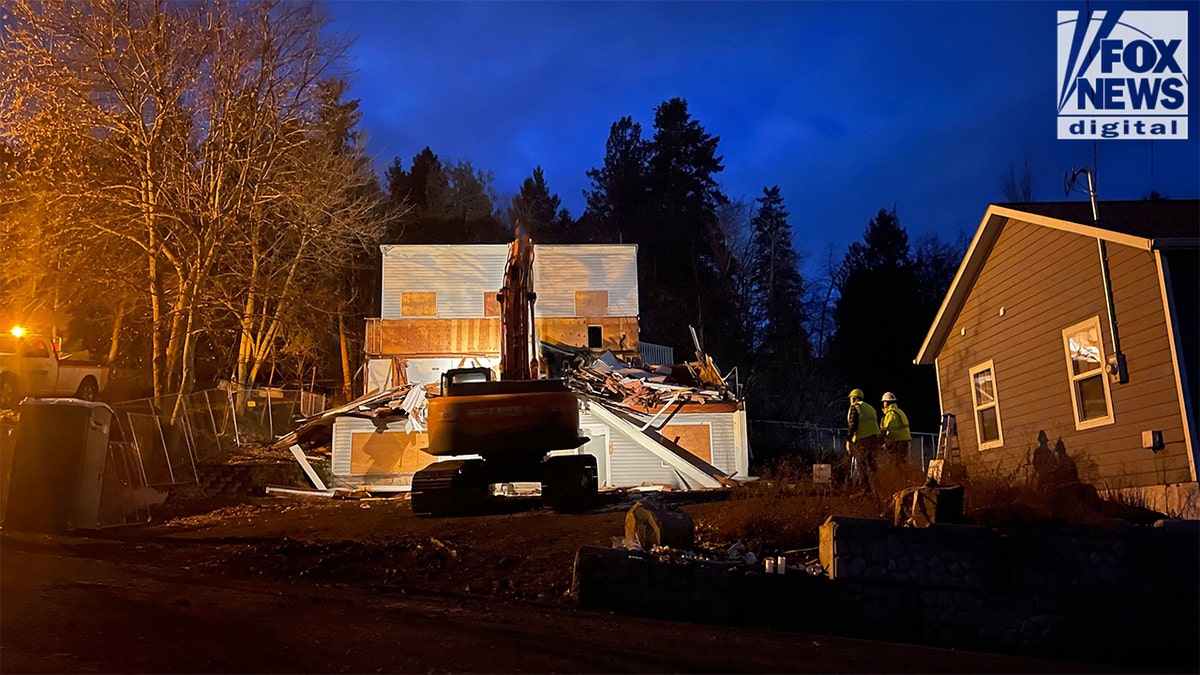 An excavator demolishes the King Road home in Moscow, Idaho