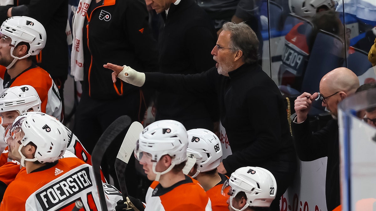 John Tortorella yells on ice