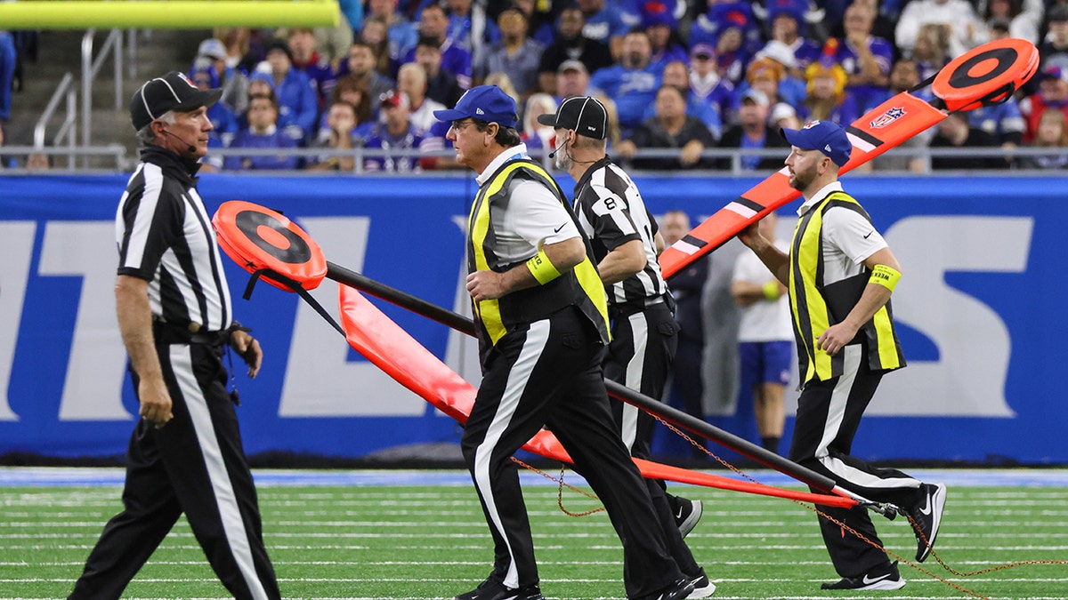 NFL chain crew runs on field