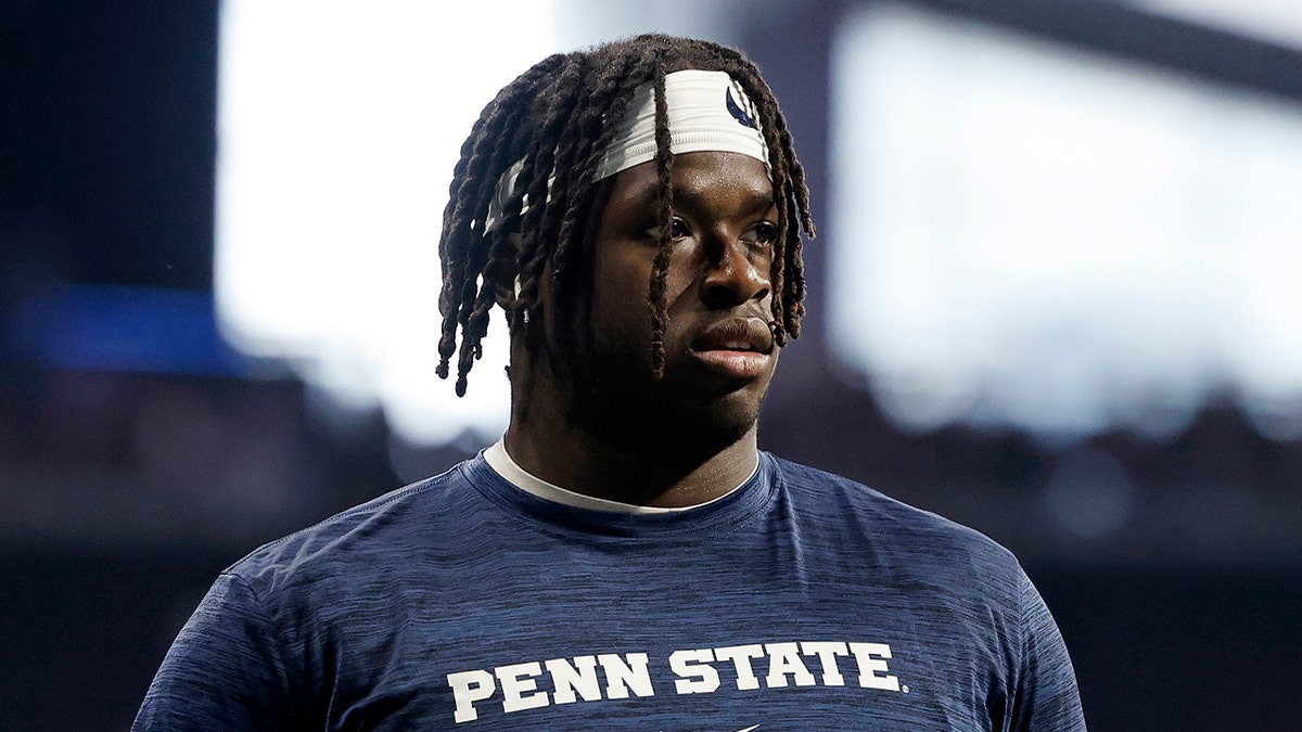 Olu Fashnu walks on field