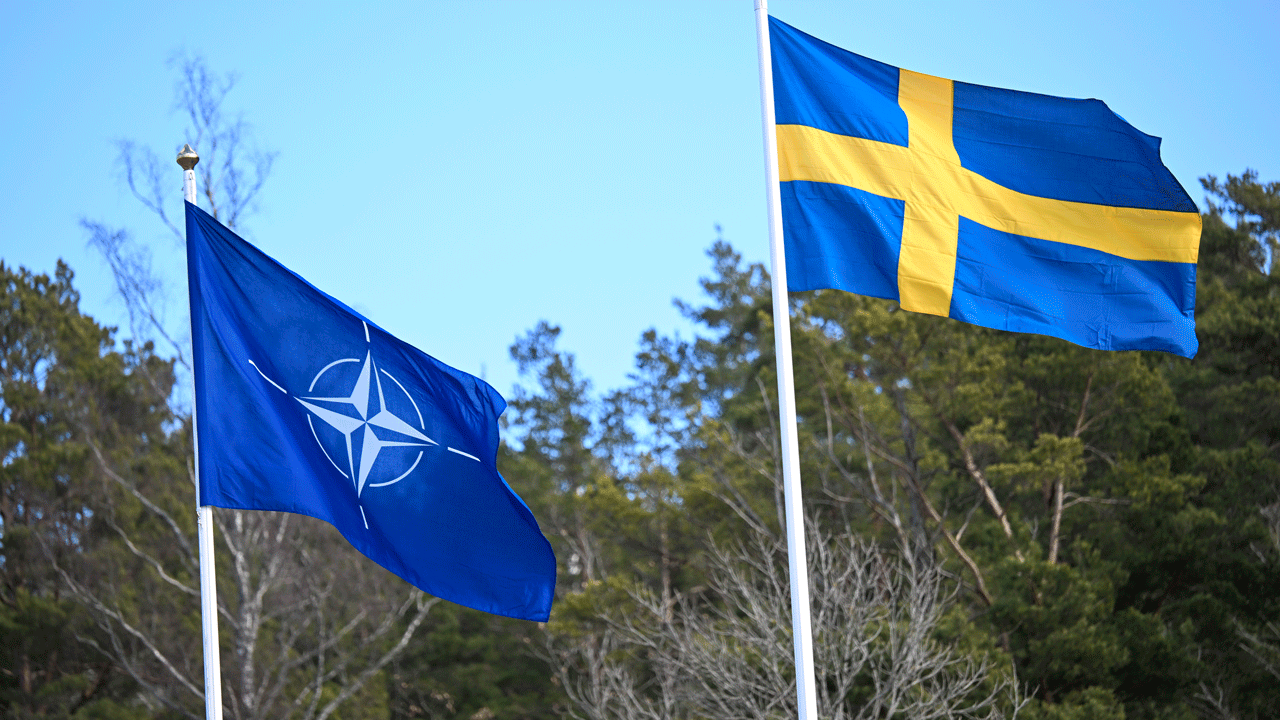 Sweden’s flag is raised at NATO headquarters to cement its place as the 32nd member of the alliance