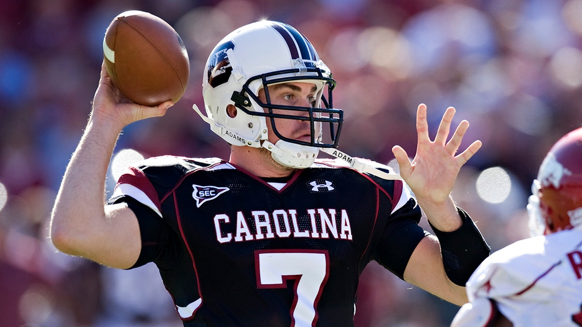 Chris Smelley throws a pass