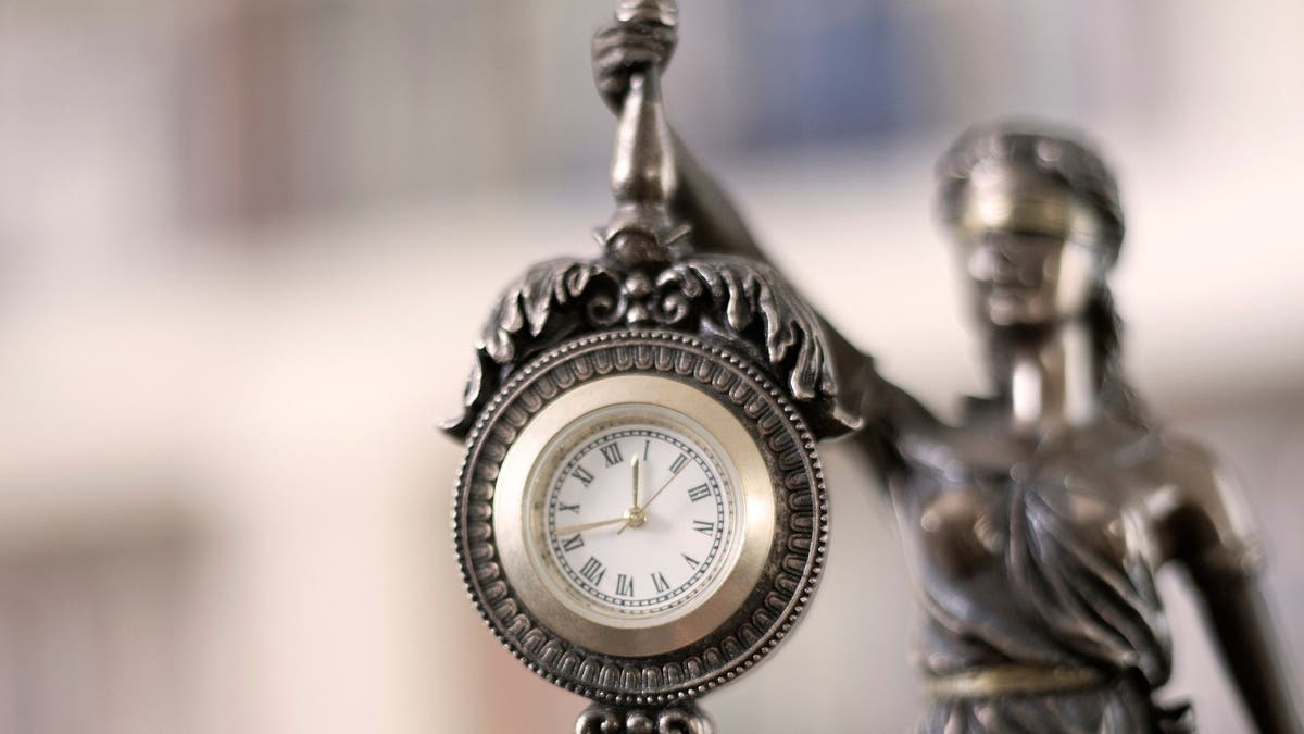 clock on the justice statue