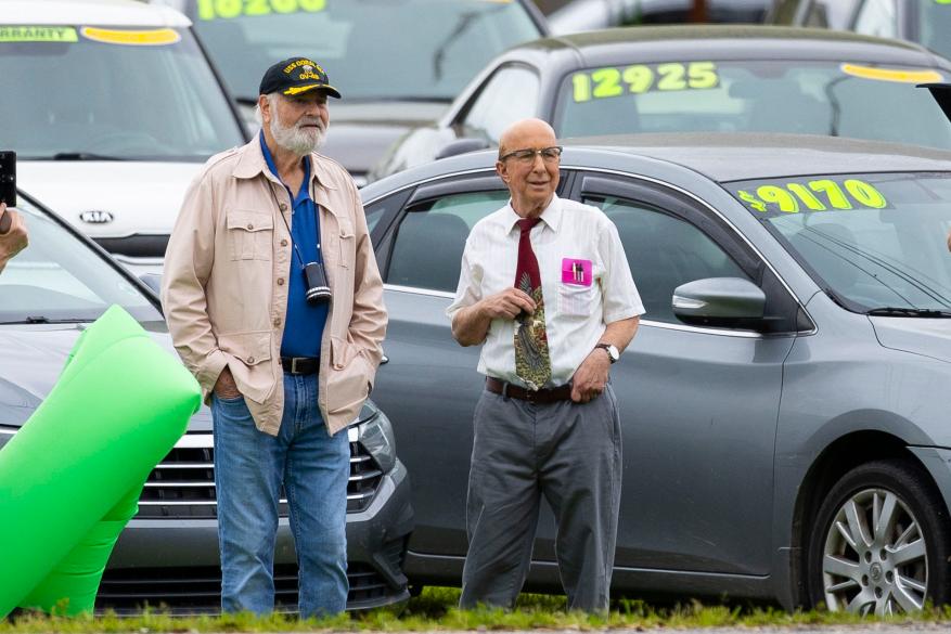 Director Rob Reiner and actor Paul Shaffer standing next to a car on the film set of the sequel to 'This Is Spinal Tap'