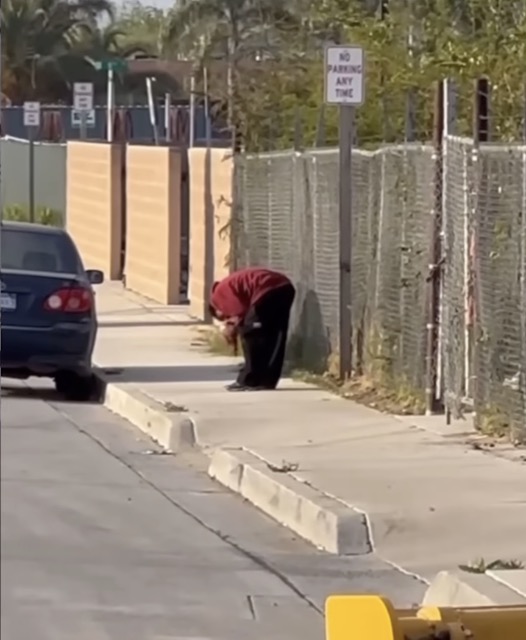 The man holding the severed leg.