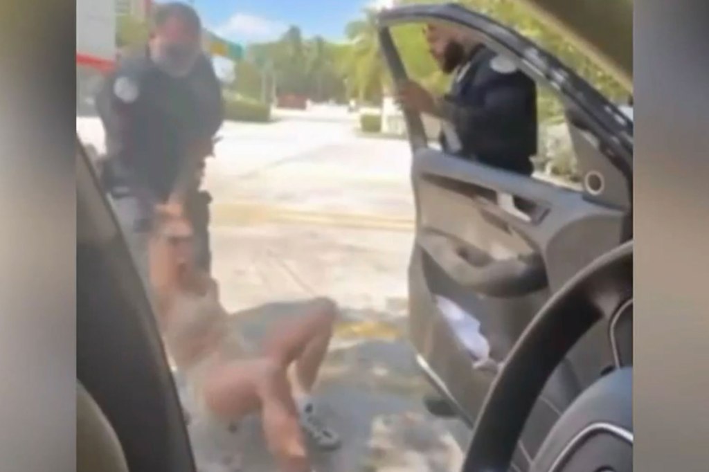 New video shows an intense traffic stop that ended with a singer being pulled out of a car and handcuffed in Sunny Isles Beach