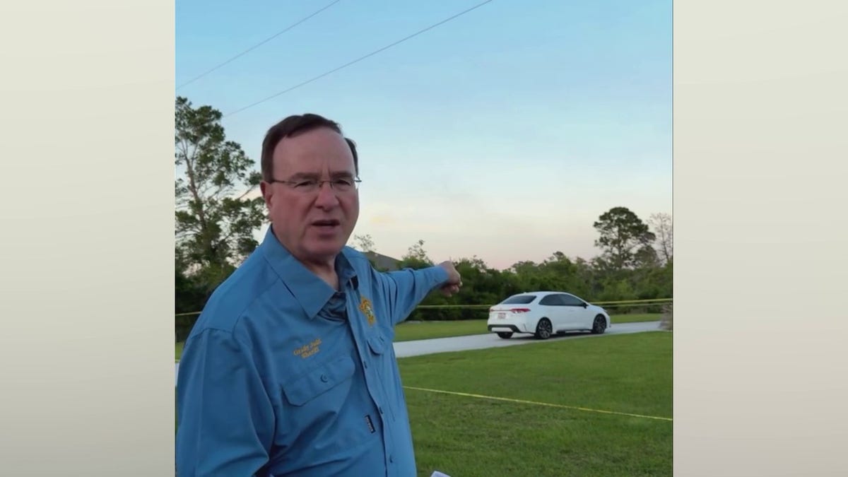 Polk County Sheriff Grady Judd talking at the scene of the crime