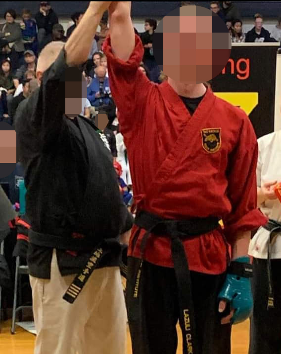 A multi-discipline transgender female athlete, pictured above at a tae kwon do match, was allegedly suspended from a female rowing team for ogling a topless girl.  