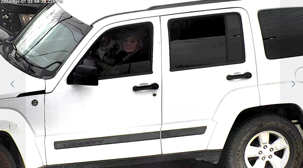 A photo of Angela Harrison, provided by the Tulsa Police Department, shows her inside of the stolen vehicle. 