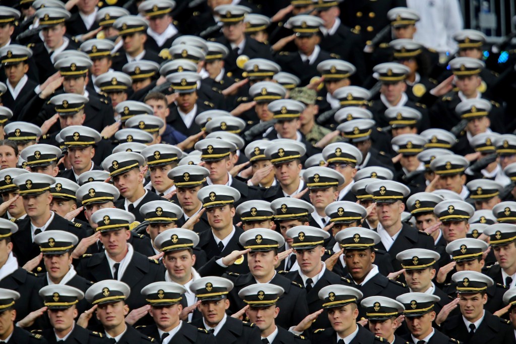 Navy sailors saluting
